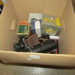 A box of camera's and lenses etc.