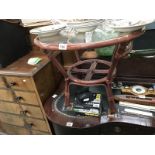 A round glass topped cane coffee table