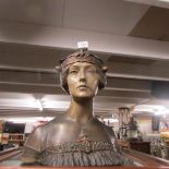 A bust of a woman with crown signed R.