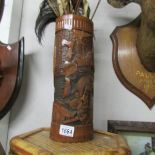An oriental carved wood vase / brush pot.
