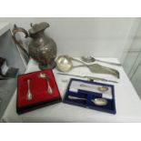 A silver plated jug, cutlery etc.