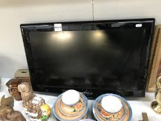 A 26" Samsung flat screen TV without a stand