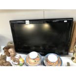 A 26" Samsung flat screen TV without a stand