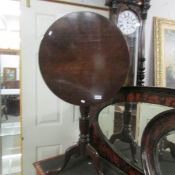 An oak tip top tripod table.