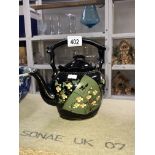 A black & floral teapot with gilded trim & details