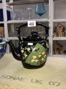 A black & floral teapot with gilded trim & details