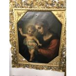 A large gilt framed oil on canvas painting of Madonna and child.