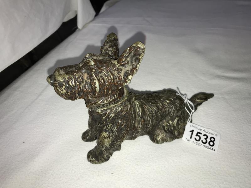 A table lighter incorporating ashtray in the shape of a terrier dog.