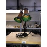 An art nouveau table lamp with double flower shades