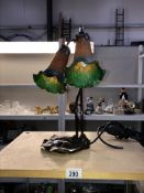 An art nouveau table lamp with double flower shades