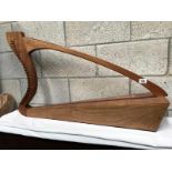 A handmade harp inscribed (?) K. Cain MCMLXXV, West Dean Fecit.