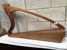 A handmade harp inscribed (?) K. Cain MCMLXXV, West Dean Fecit.