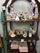 3 shelves of fairy ornaments