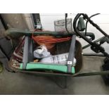 A wheelbarrow & contents (gas stove, gardening stool, rodent trap & strimmer etc.
