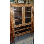 A bamboo cabinet having 2 doors and 2 drawers.