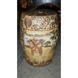An oriental style pottery stool.