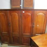A mahogany 4 door bookcase.