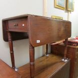 A mahogany Pembroke table.