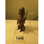 A superb quality bronze figure of a dachsund in hunting gear and carrying a rifle.