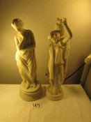 2 Grecian style figurines.