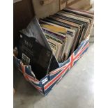 A box of approximately 150 12" LP records