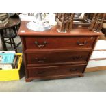 An inlaid chest of drawers