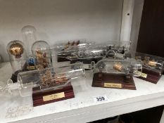 A collection of 6 ships in bottle on stands & 3 other ships etc.