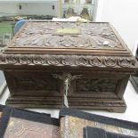 A Victorian carved oak Bible box made from an oak pawl used for mooring ships for 70 years at the