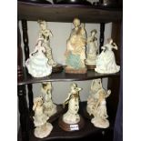 2 shelves of biscuit porcelain lady figurines