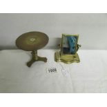 A miniature brass toilet mirror and a miniature brass trivet (possibly travellers samples).