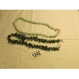 2 jade necklaces,.