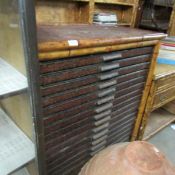 An 18 drawer specimen cabinet.