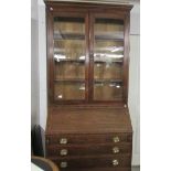 A mahogany bureau bookcase with string inlay.