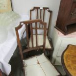 A pair of mahogany bedroom chairs.
