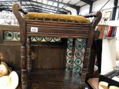 An upholstered piano stool