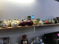 A large collection of novelty storage/condiment jars including Sylvac etc.