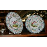 A pair of Royal Doulton cabinet plated decorated with birds.