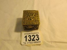 A 19th century embossed brass pill box.