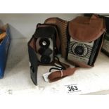 A boxed Brownie camera & a Brownie Reflex camera
