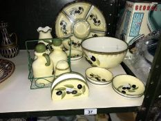 A quantity of grape decorated pottery tableware