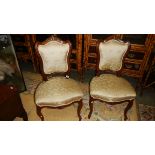 A pair of ornate Victorian salon chairs