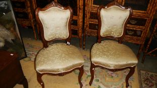 A pair of ornate Victorian salon chairs