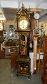 A superb lacquered long case clock with Chinese scenes and multi chime, in full working order.