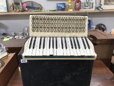 A Hohner Carmen II accordian in box (needs attention)