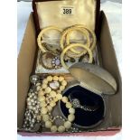 A mixed lot of costume jewellery including ladies wristwatch, bone bangle & cameo brooches etc.