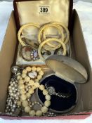 A mixed lot of costume jewellery including ladies wristwatch, bone bangle & cameo brooches etc.