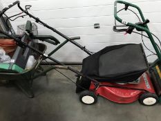 A petrol lawn mower Honda GCV135 4.