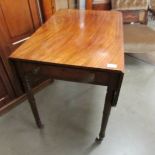 A mahogany Pembroke table.