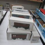 Approximately 20 '00' gauge rolling stock in home made boxes.