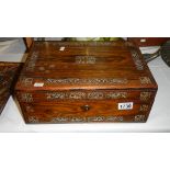 A mahogany writing box inlaid with mother of pearl.